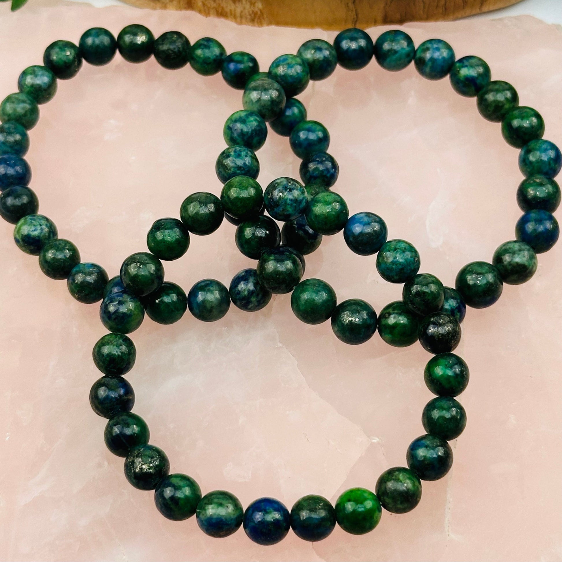 close up of the details on these mala bracelets 