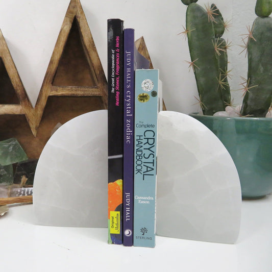 selenite book ends on display with books