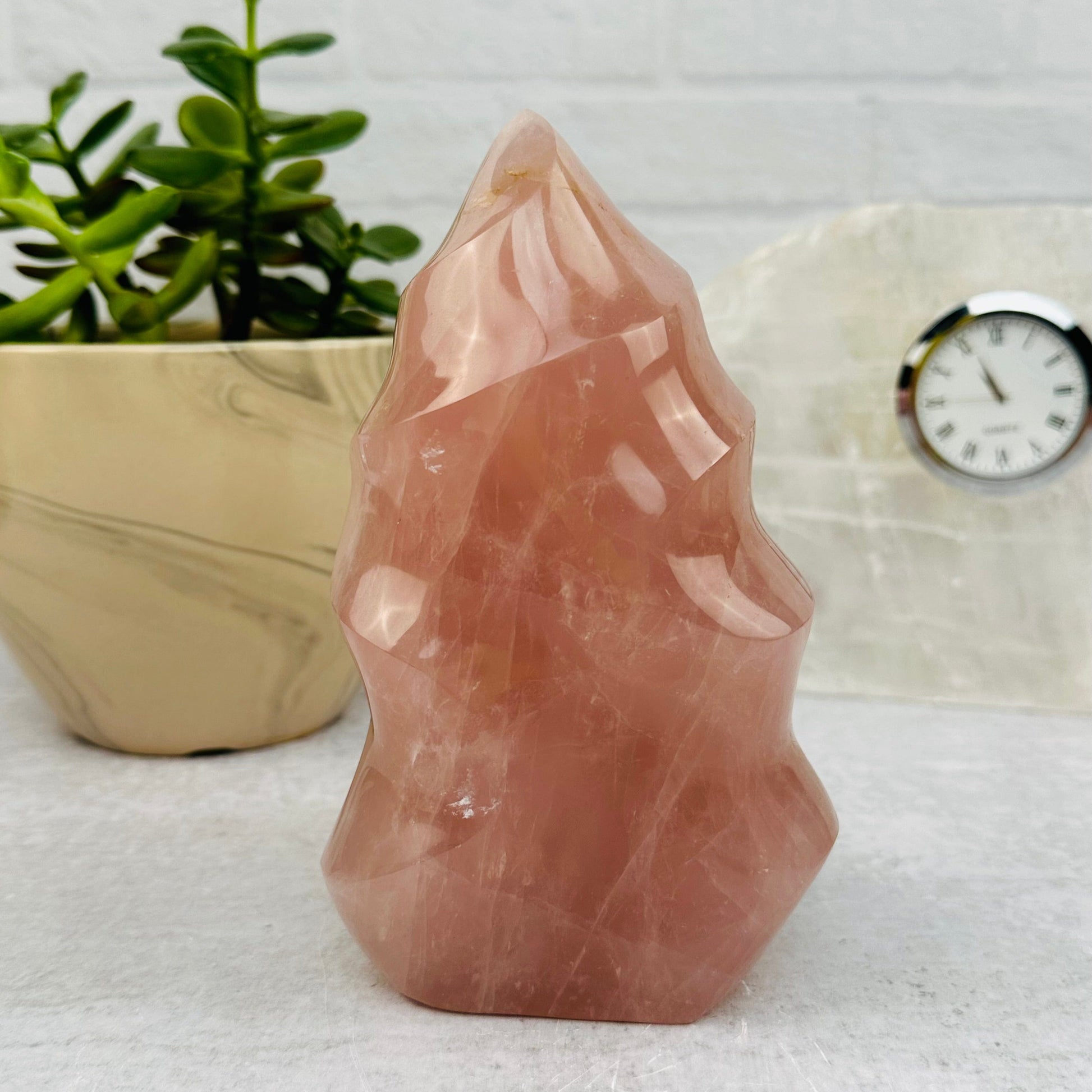 Rose Quartz Flame Tower displayed as home decor 