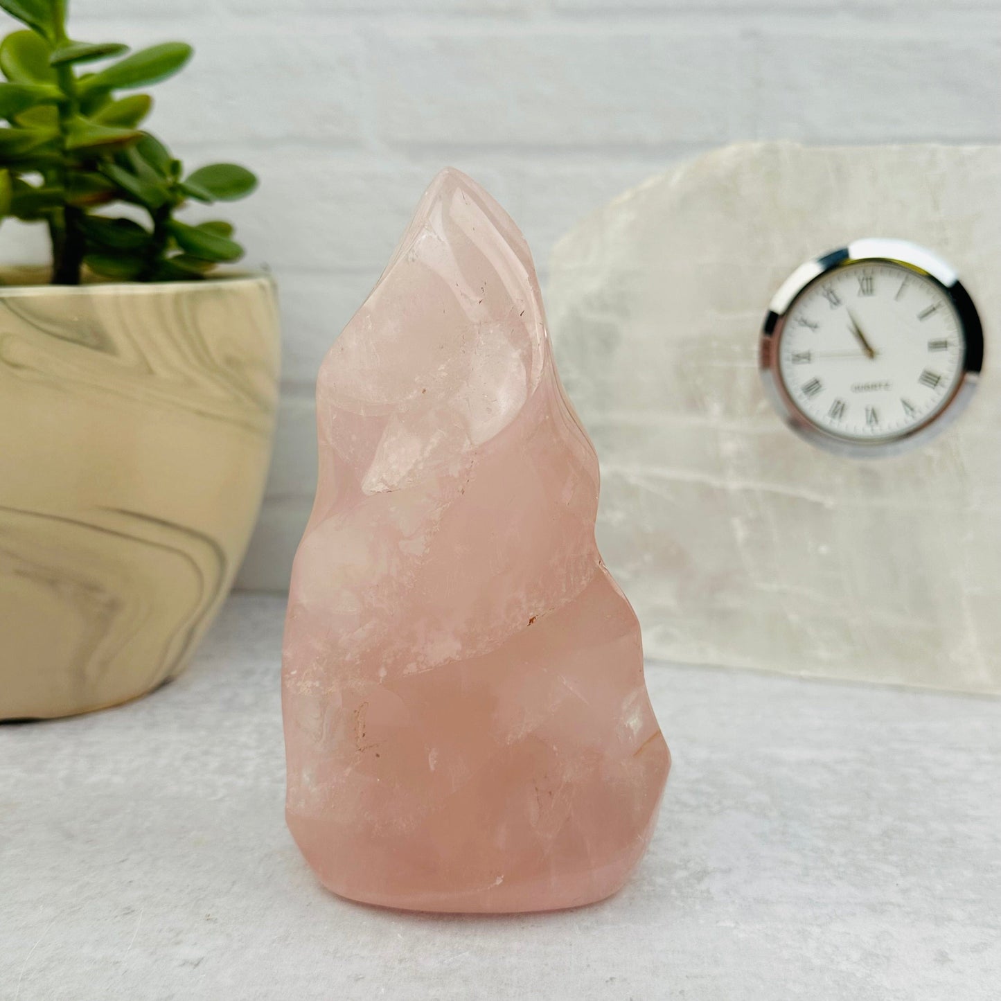 Rose Quartz Flame Tower displayed as home decor
