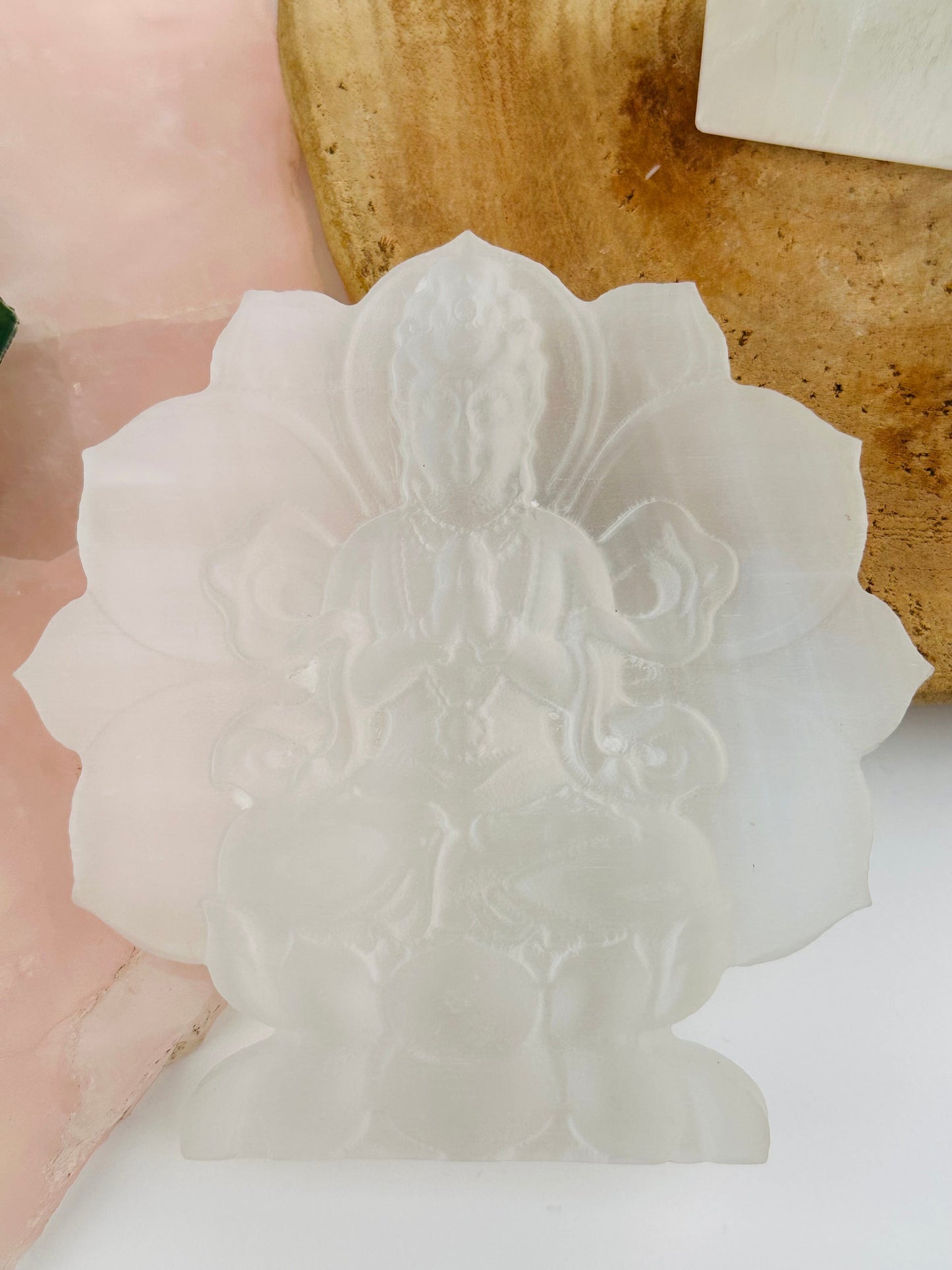 guanyin selenite carving displayed as home decor