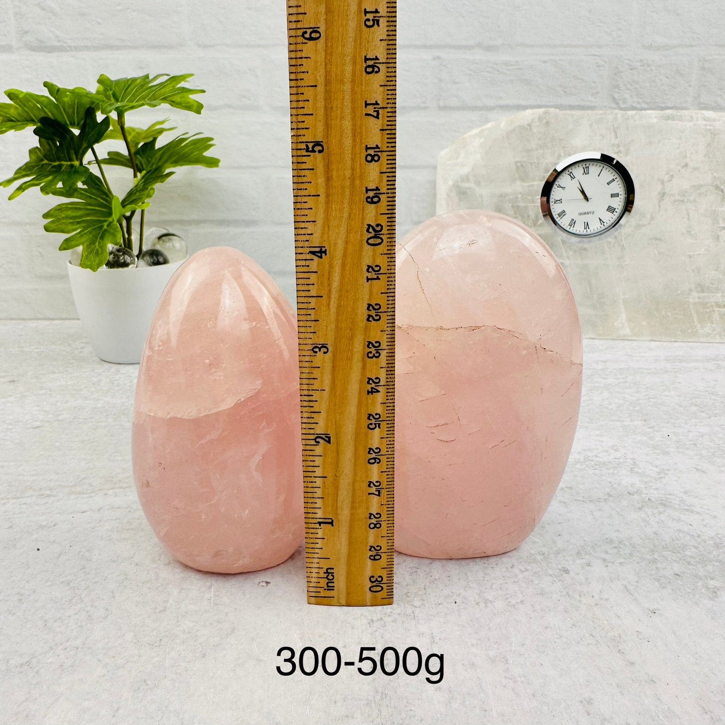 Rose Quartz Cut Base - By Weight - next to a ruler for size reference