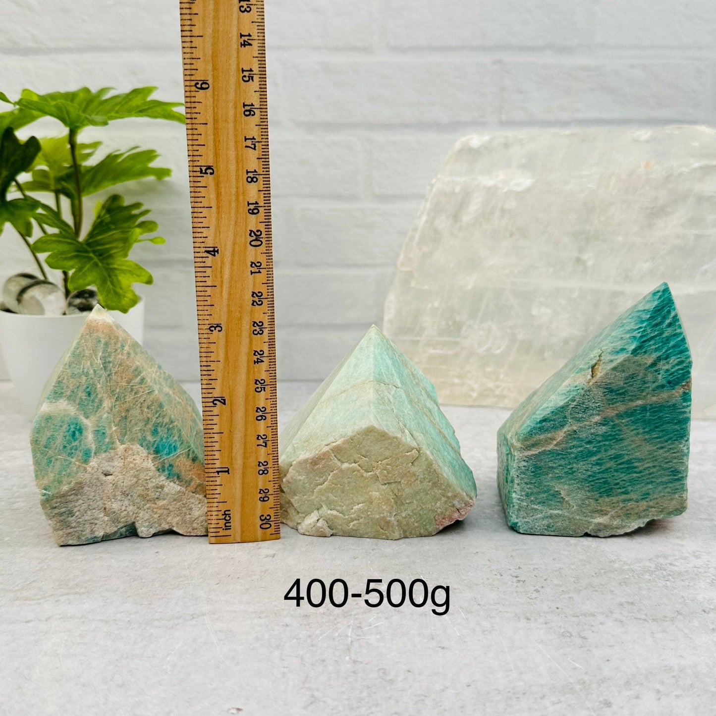 Amazonite Semi Polished Point - By Weight - next to a ruler for size reference