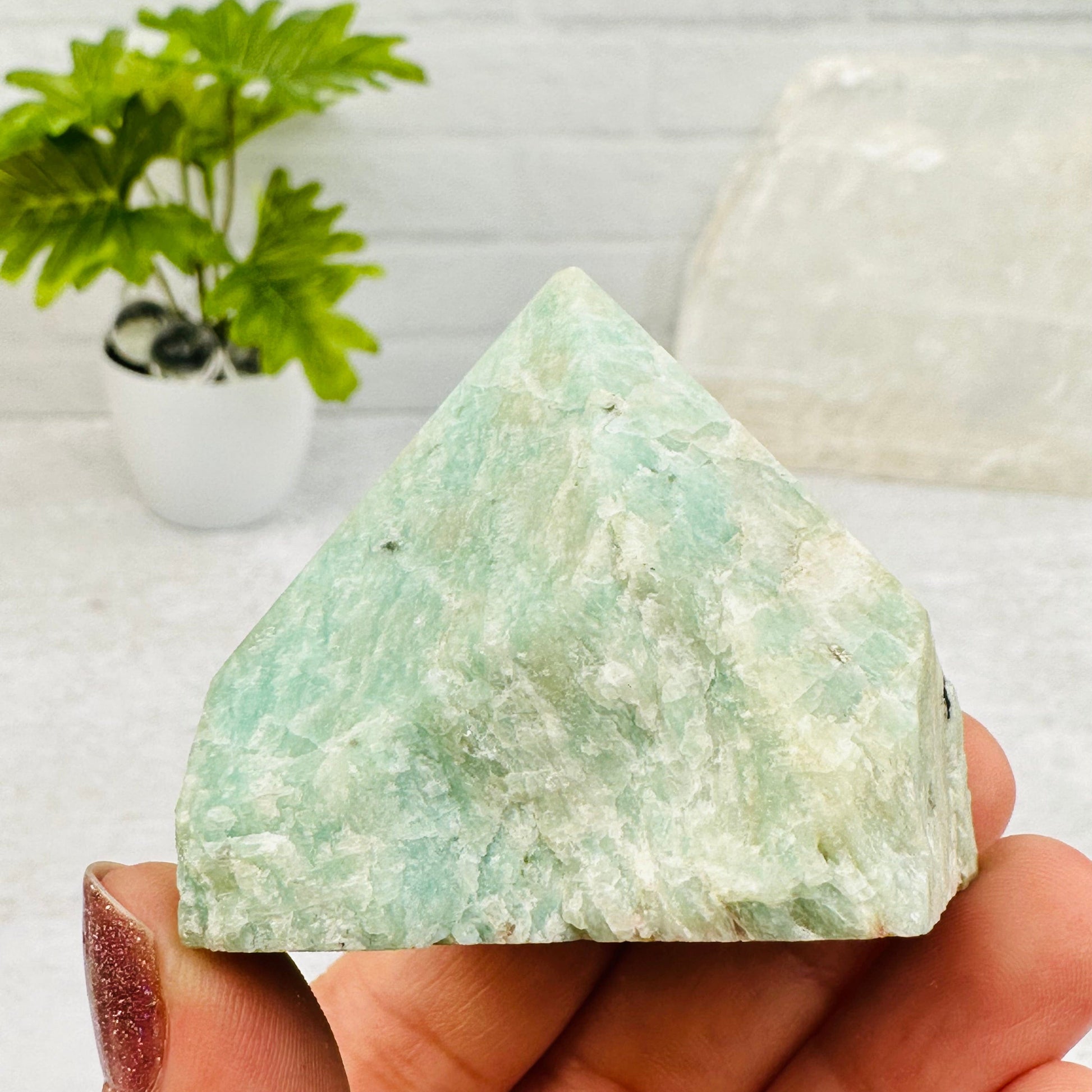 Amazonite Semi Polished Point - By Weight in hand for size reference 