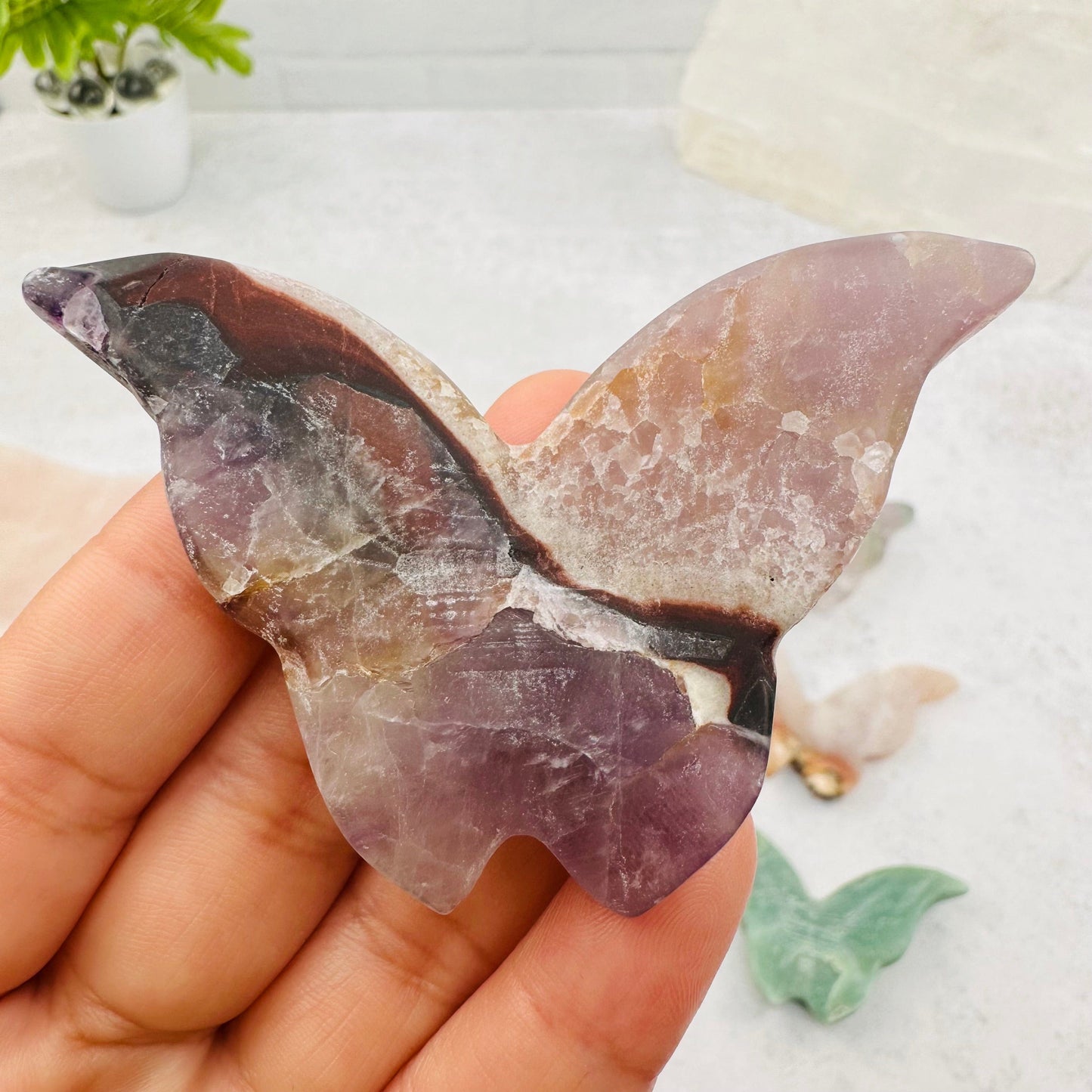 close up of the details on this carved amethyst butterfly