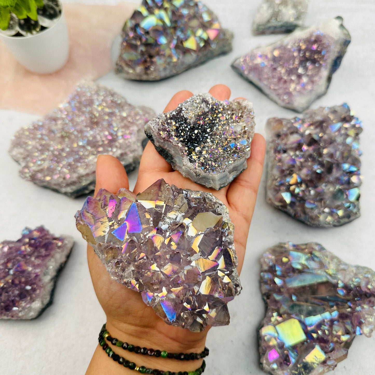 Amethyst Druzy Crystal Cluster with Angel Aura Pearly Finish in hand for size reference 