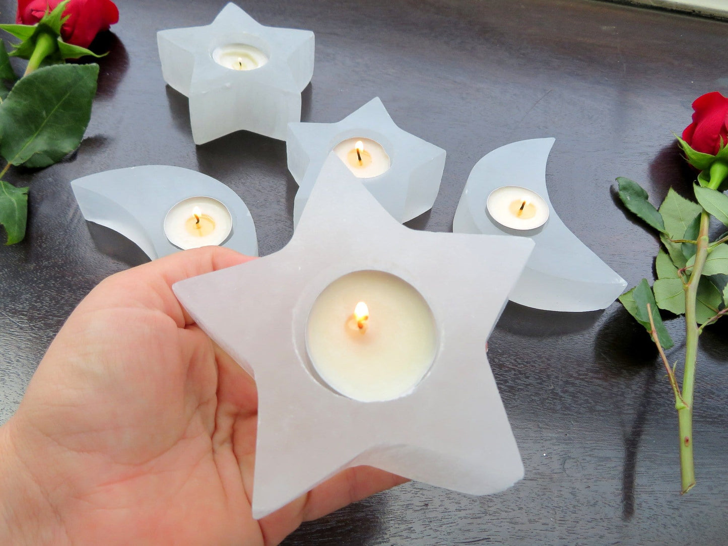 selenite star candle holder in hand for size reference