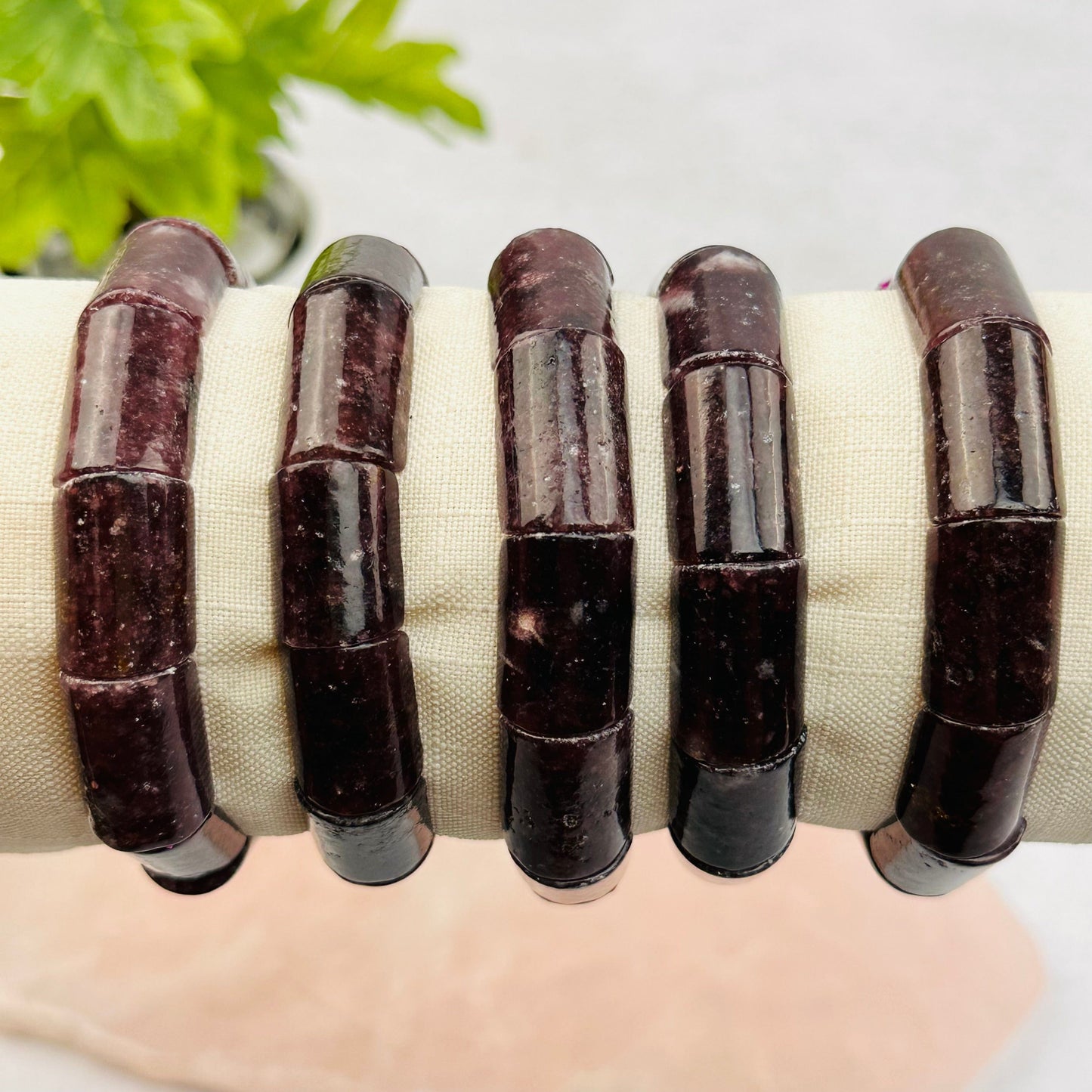 close up of the details on these lepidolite bracelets 