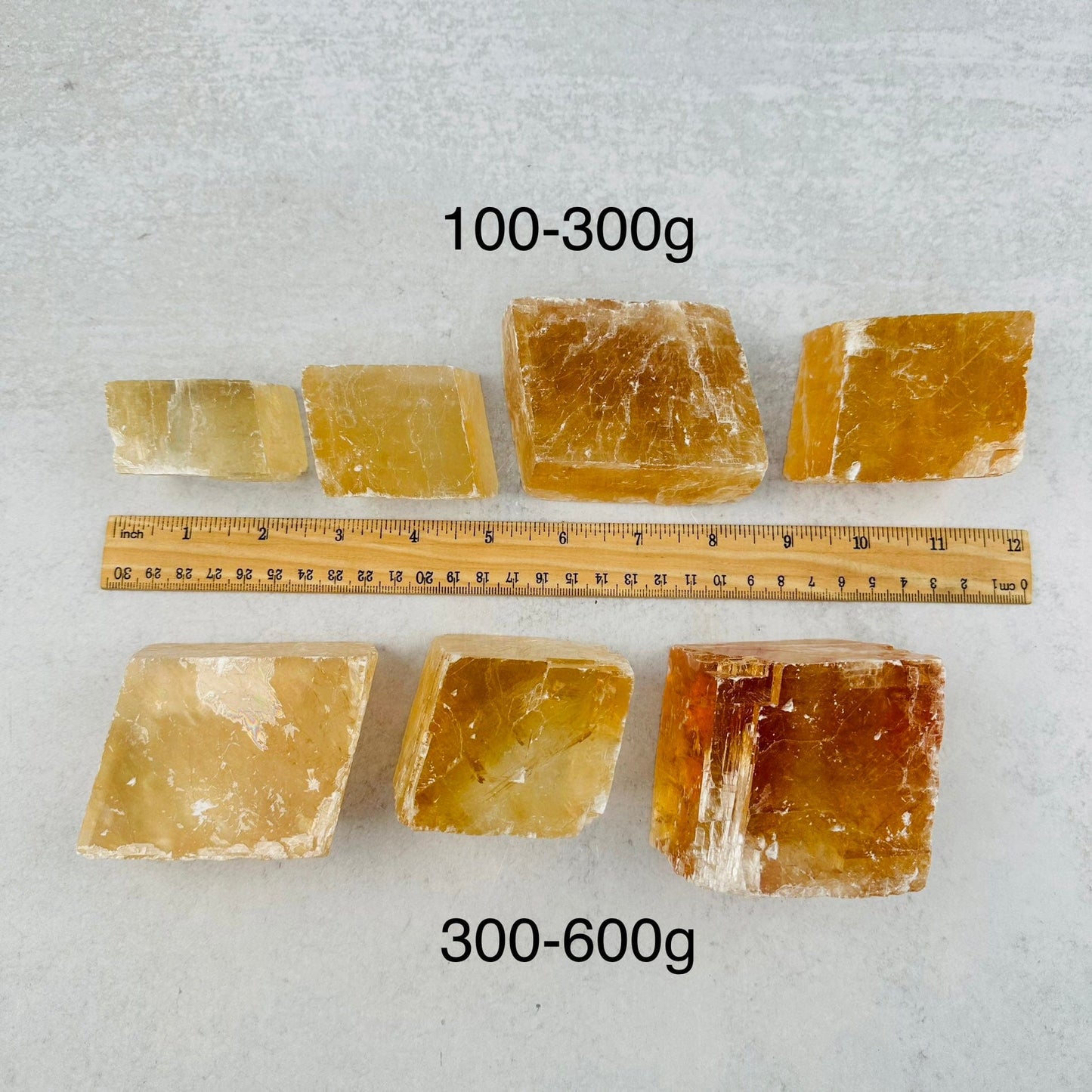 Yellow Optical Calcite - By Weight - next to a ruler for size reference 
