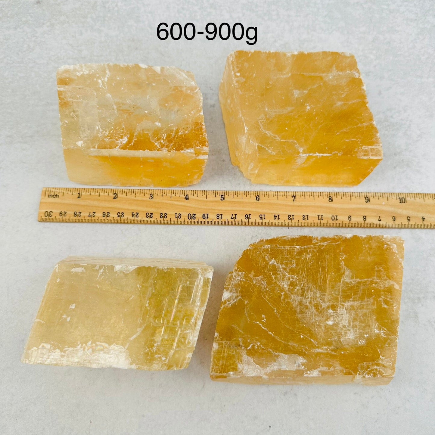 Yellow Optical Calcite - By Weight - next to a ruler for size reference 