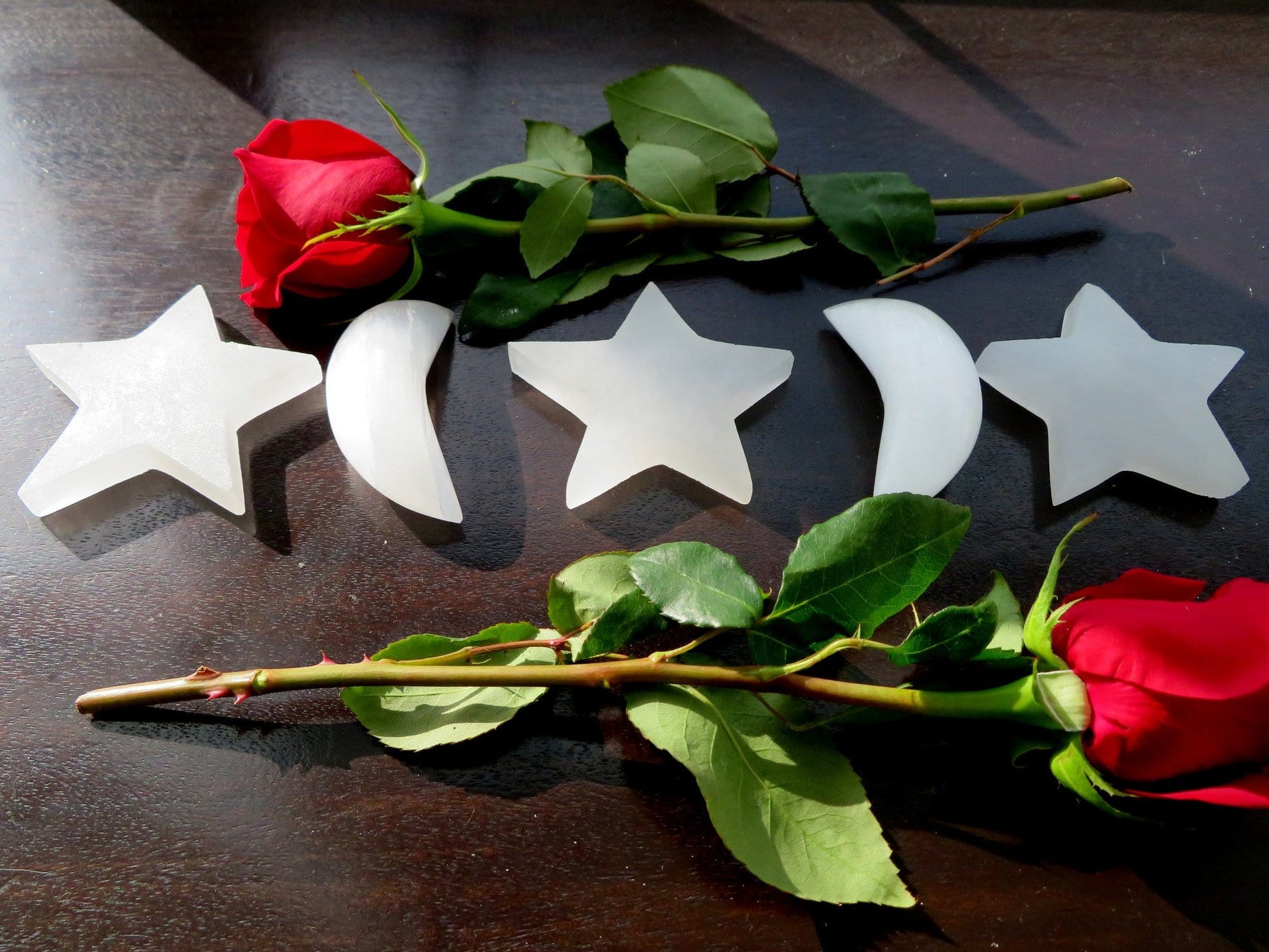 selenite crescent moons and stars on display