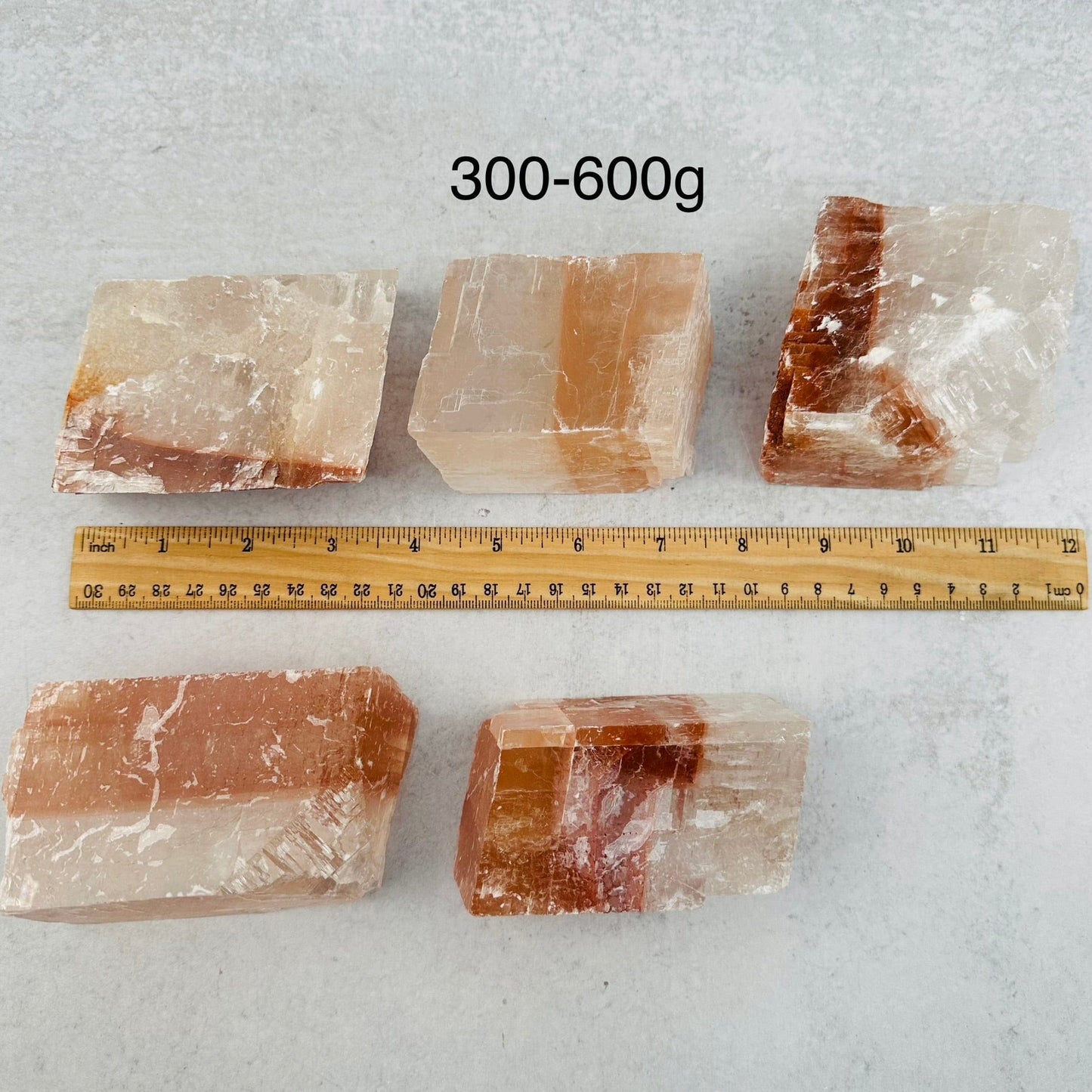 Optical Calcite - White/Red - You Choose Size next to a ruler for size reference 