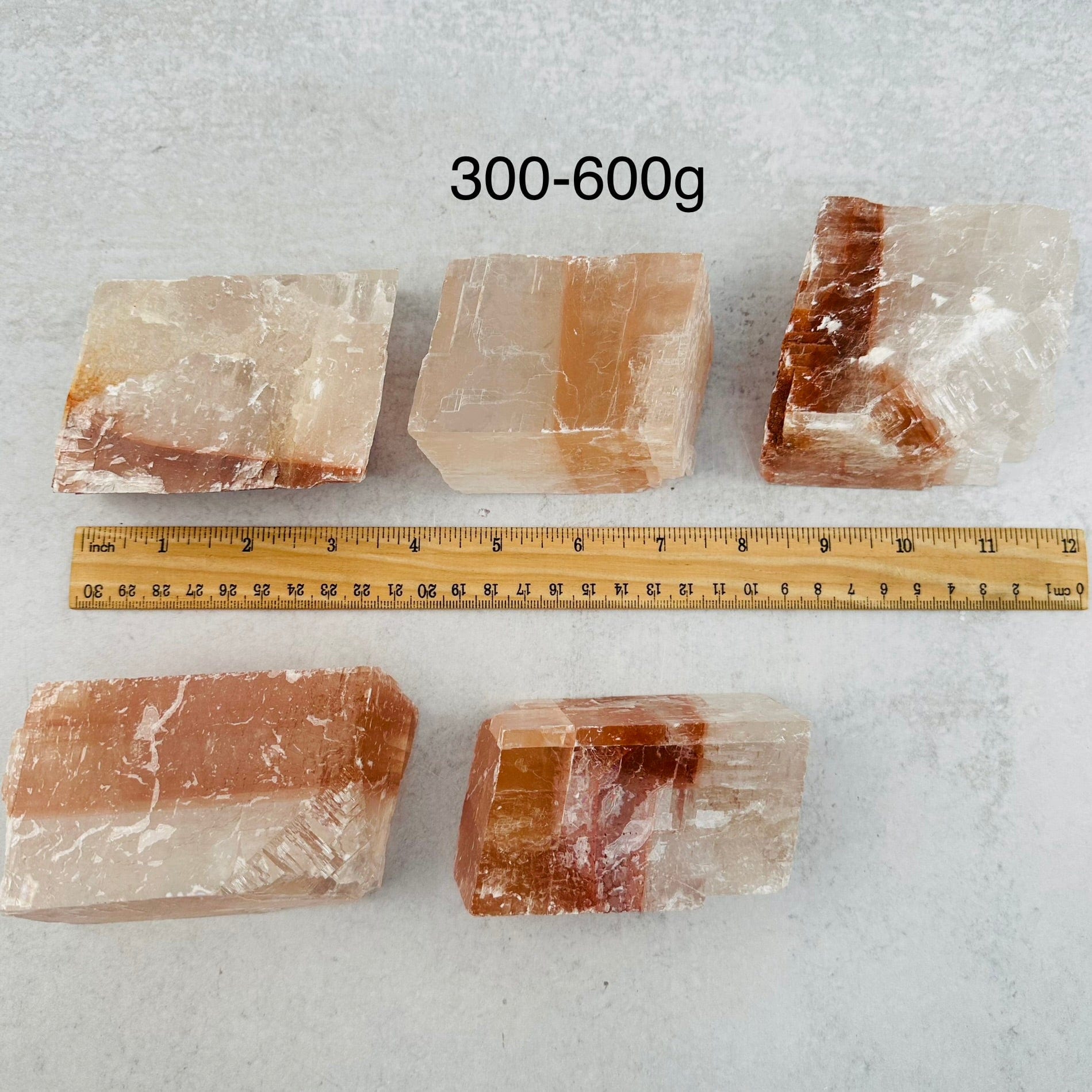Optical Calcite - White/Red - You Choose Size next to a ruler for size reference 