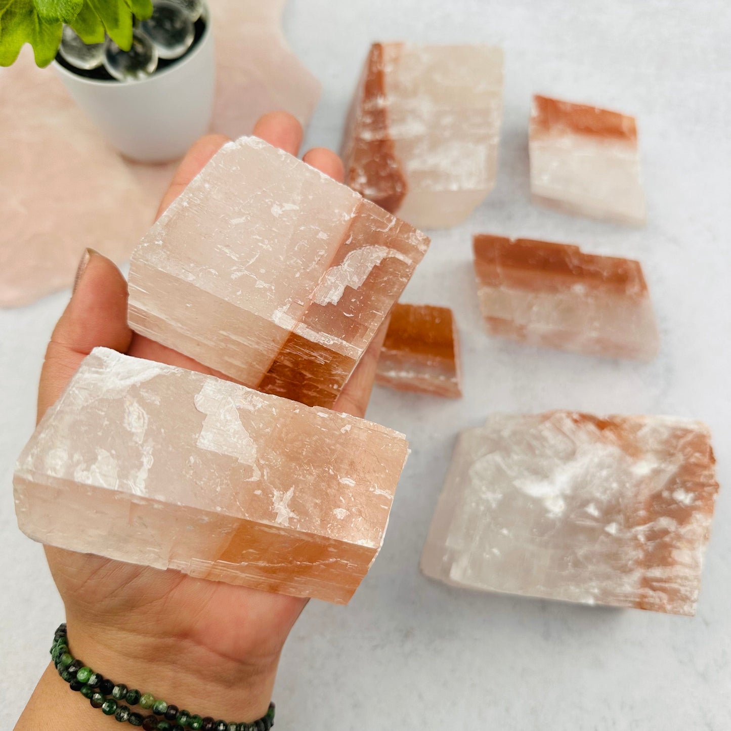 Optical Calcite - White/Red - in hand for size reference 
