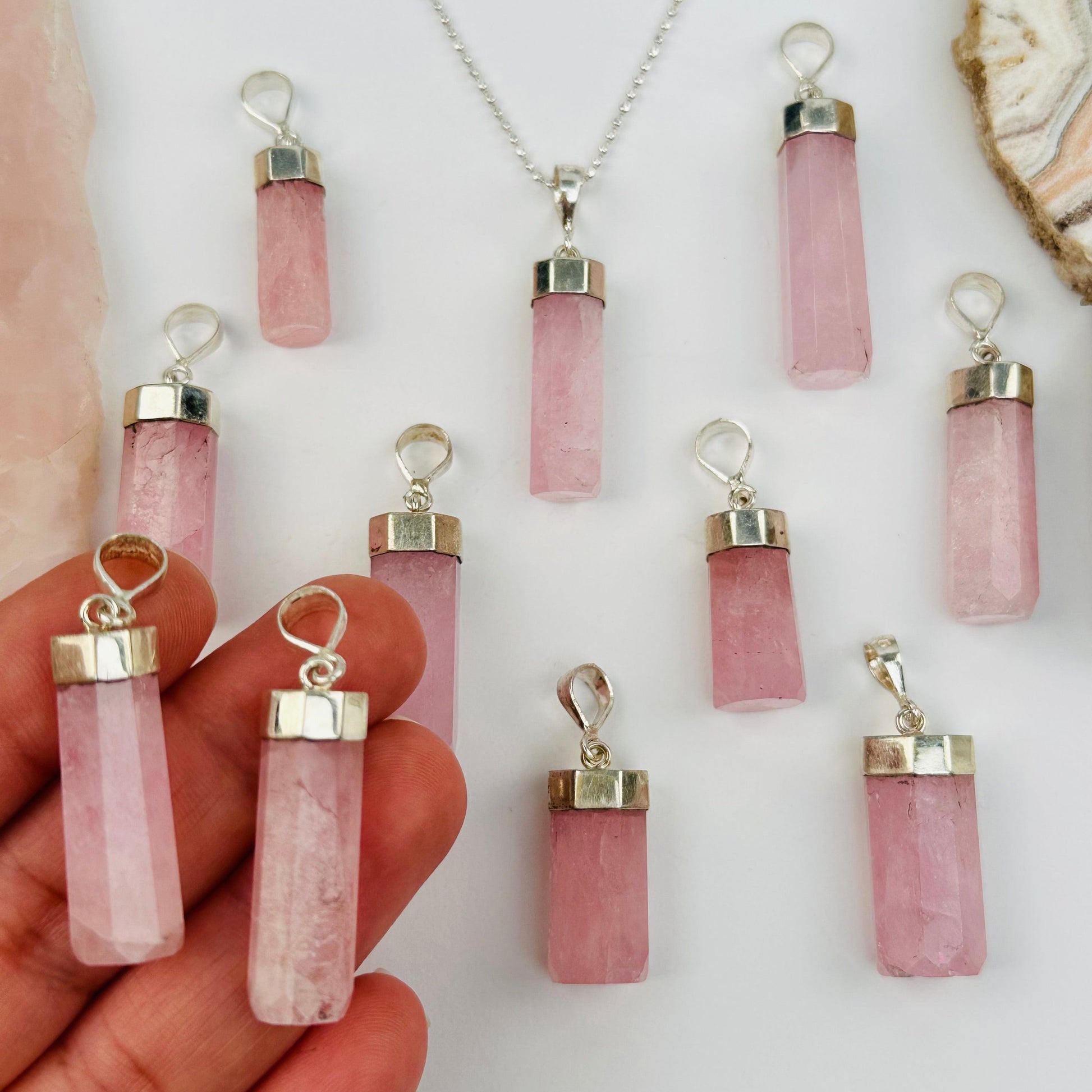 organite Crystal Pendant with Sterling Silver Cap and Bail in hand for size reference 