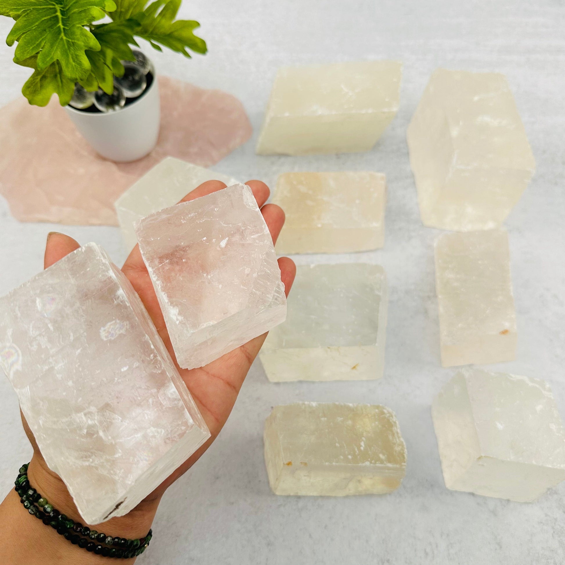 Optical Calcite - White - in hand for size reference 