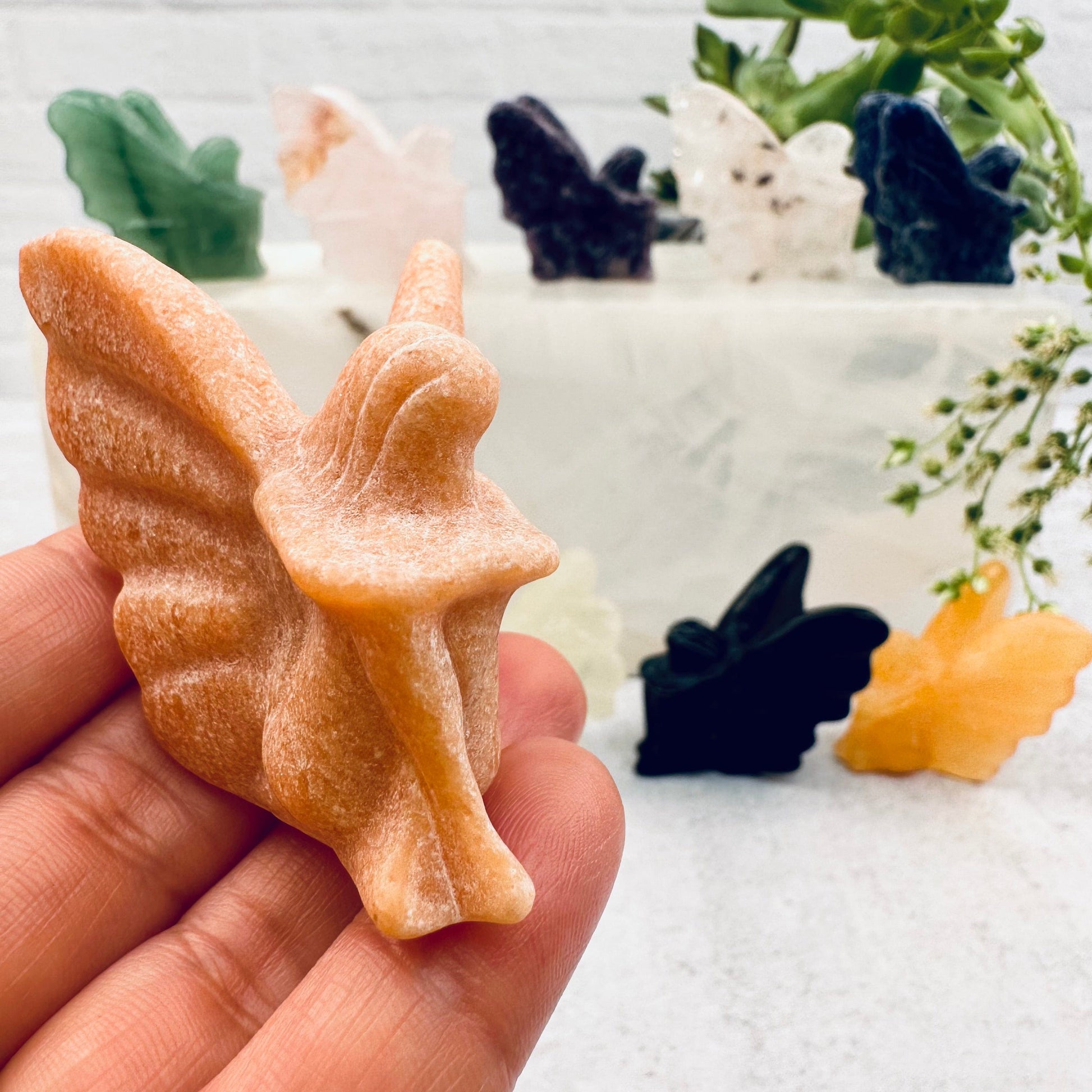 Carved Gemstone Fairy in hand for size reference 