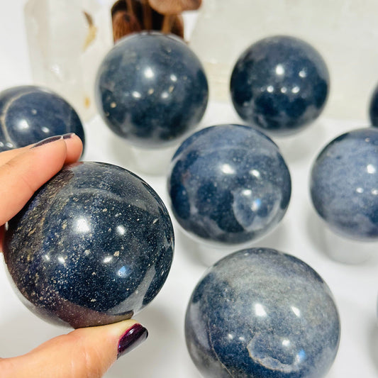close up of the details on this lazulite crystal sphere 