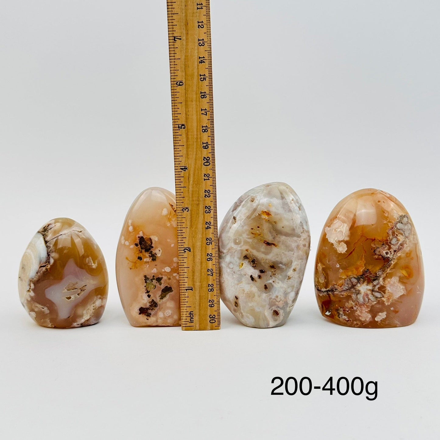 flower agate cut bases sold by weight. displayed next to a ruler for size reference 