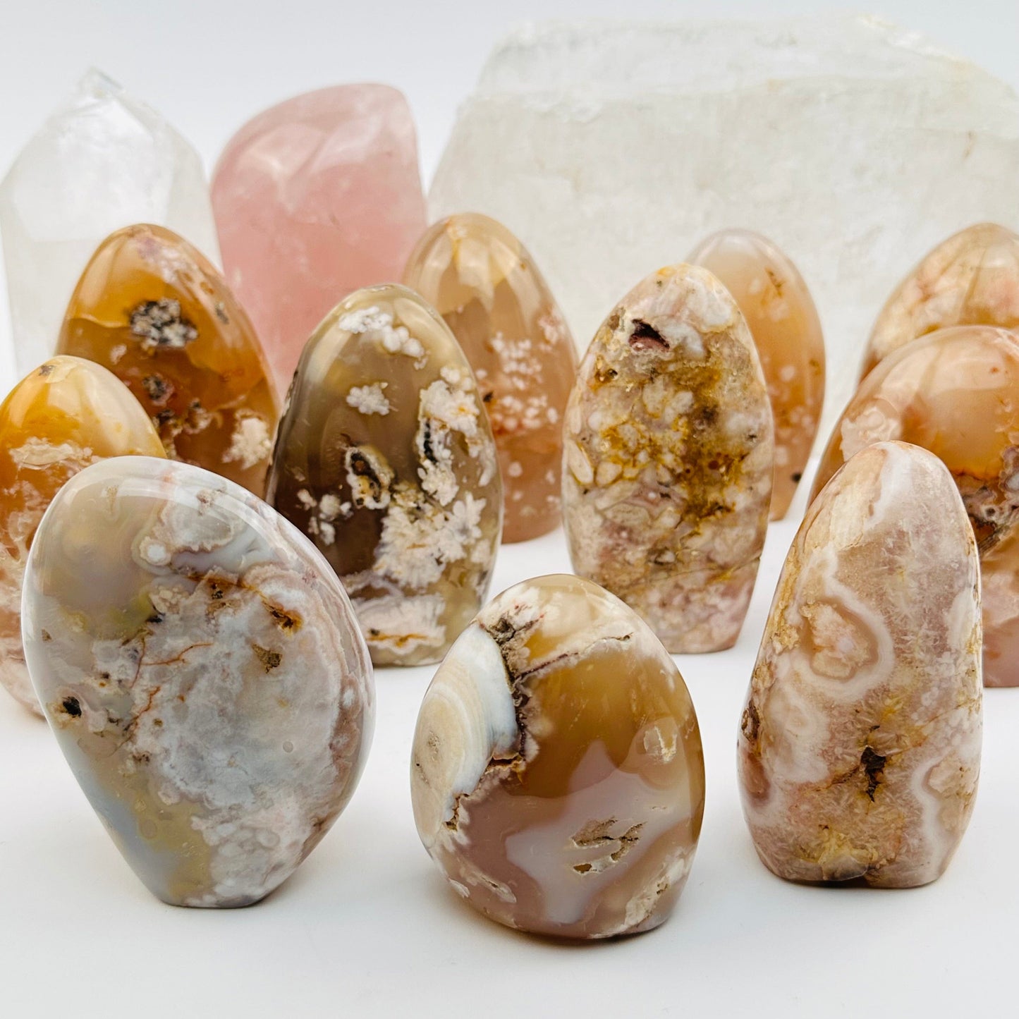 multiple flower agate cut bases displayed to show the differences in the sizes and color shades 