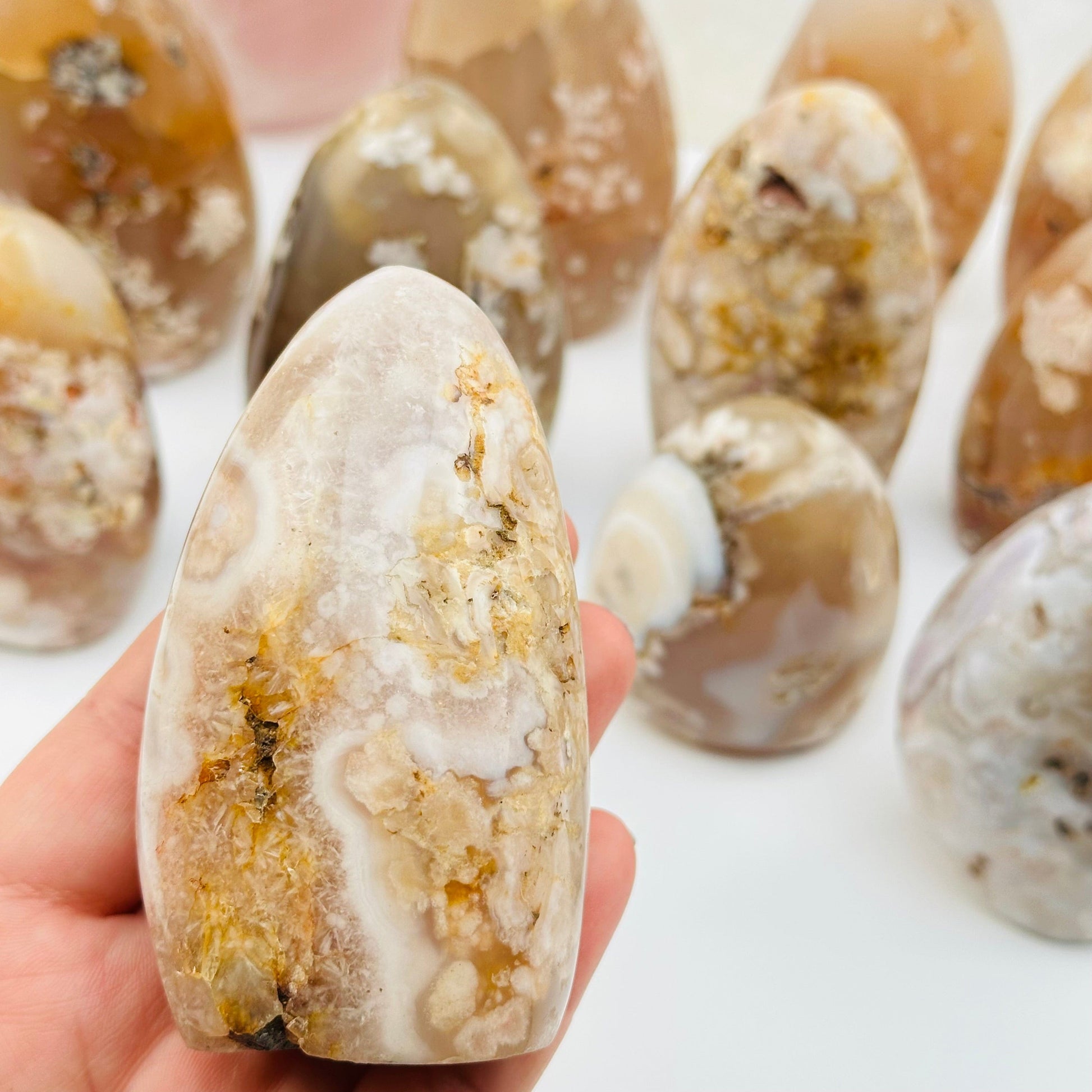 close up of the details on these flower agate cut base crystals 