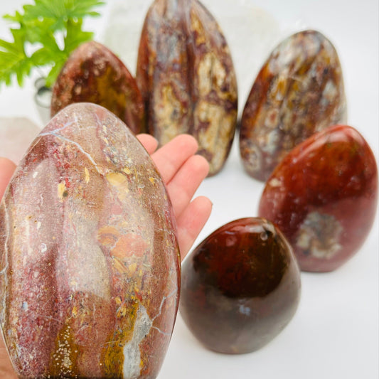 ocean jasper cut base in hand for size reference 