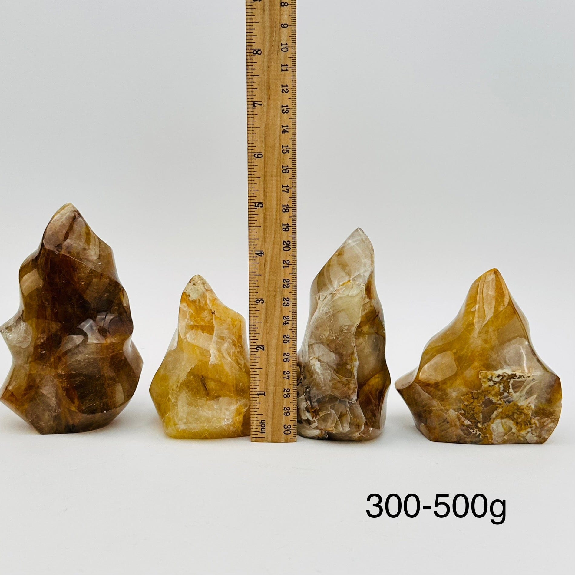 golden healer flame points sold by weight. displayed next to a ruler for size reference 