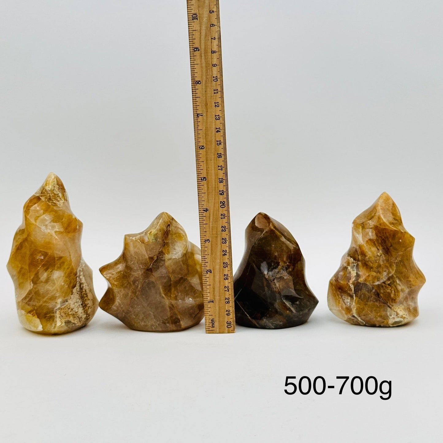 golden healer flame points sold by weight. displayed next to a ruler for size reference 