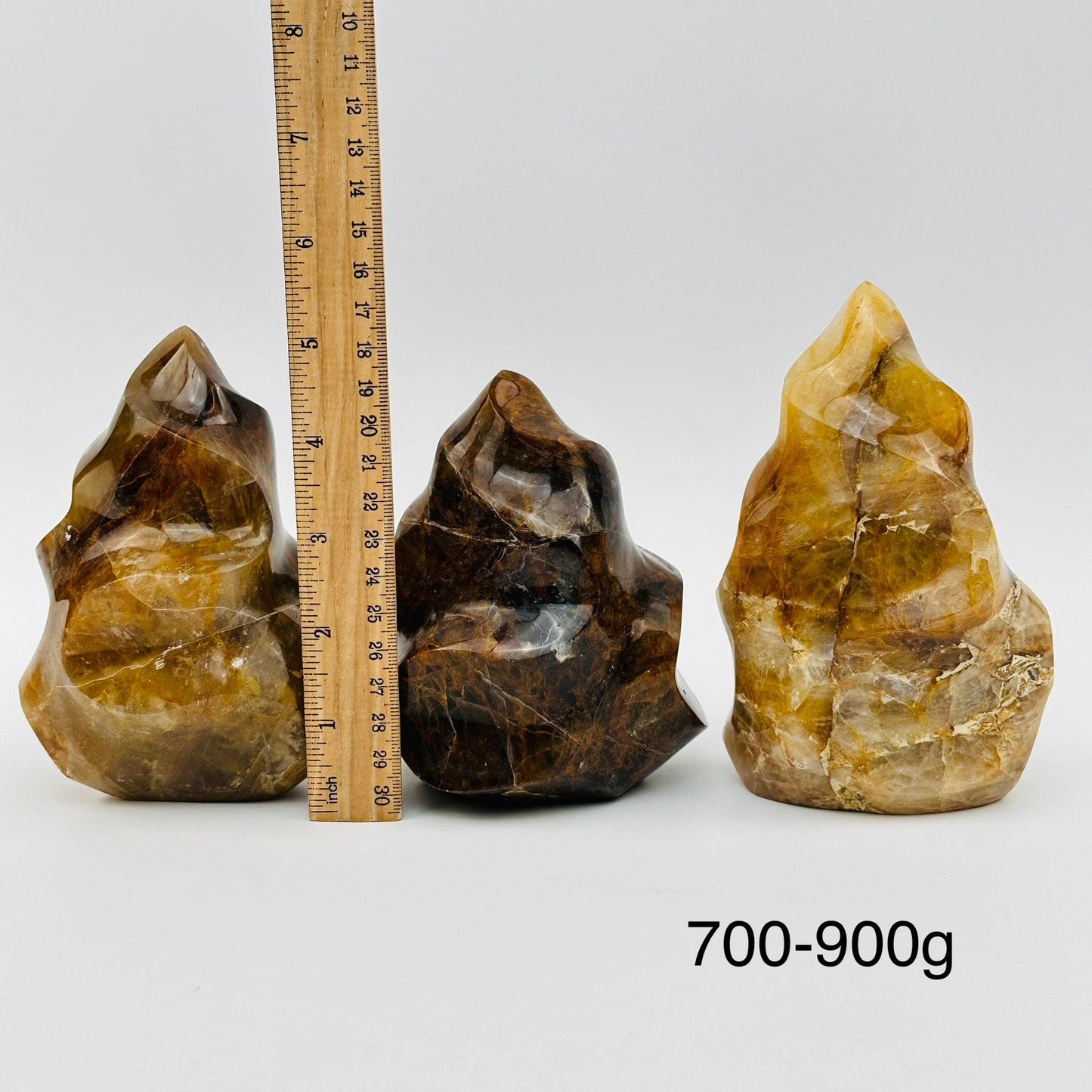 golden healer flame points sold by weight. displayed next to a ruler for size reference 