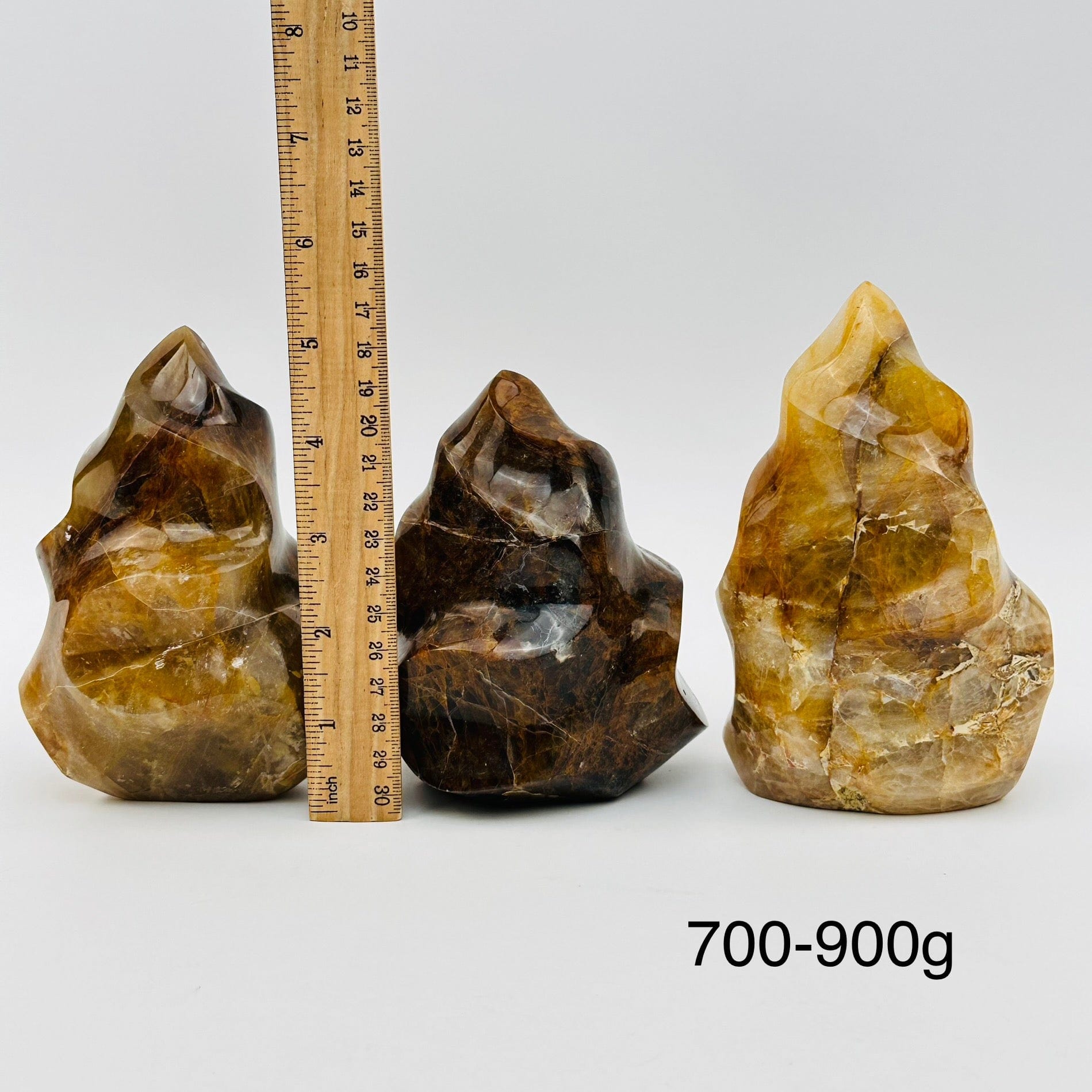 golden healer flame points sold by weight. displayed next to a ruler for size reference 