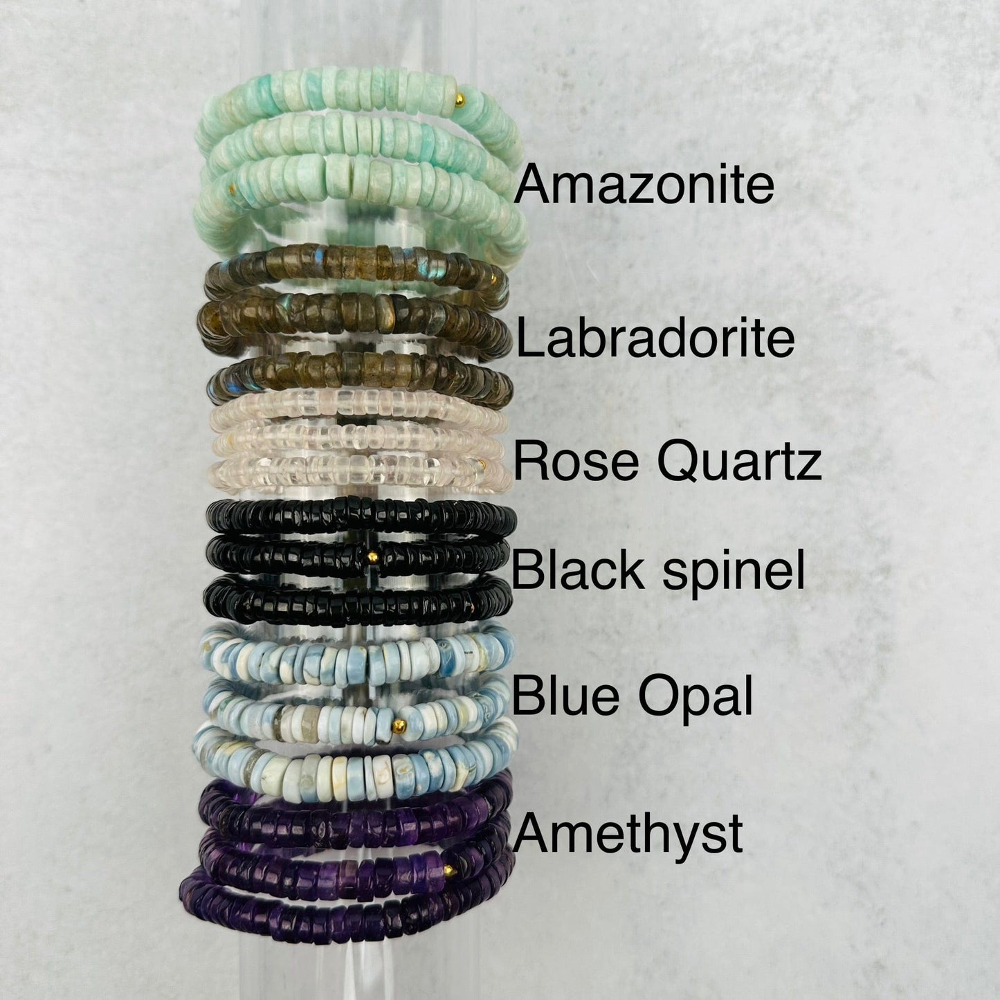 Gemstone Bracelets - 6mm Polished Beads next to their crystal name