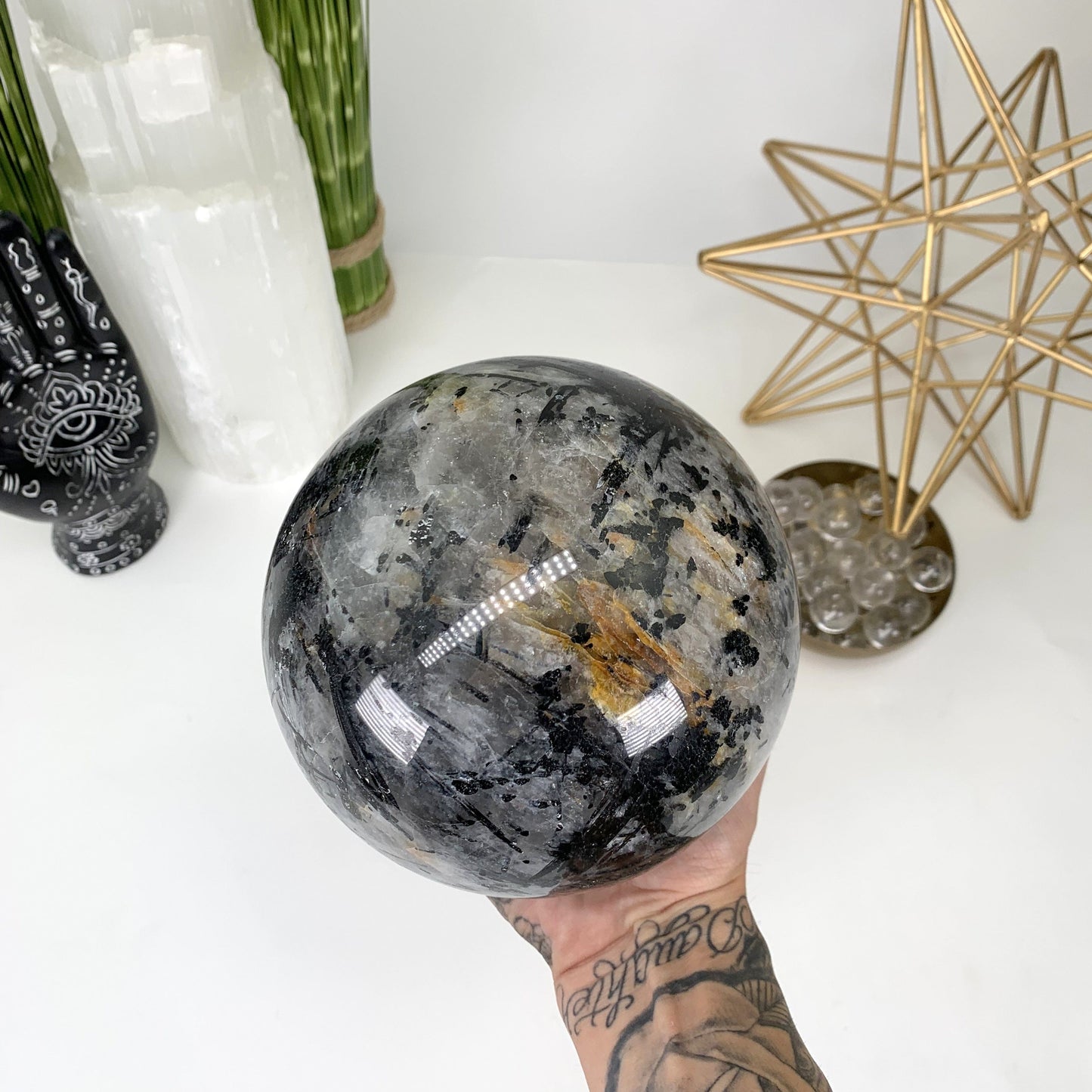 Picture of the a different angle of the sphere, showing it's natural inclusions.