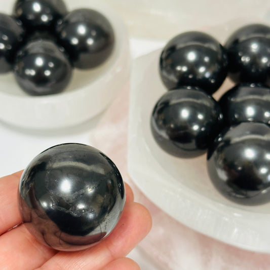close up of the details on this crystal shungite sphere 