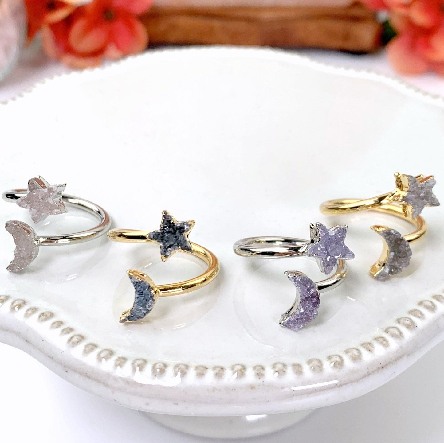 4 rings laid out on white background