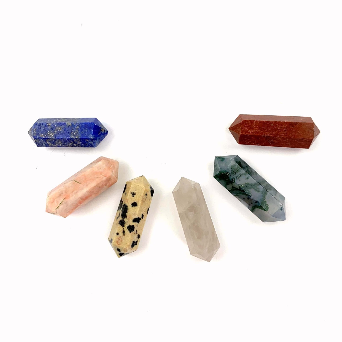 Double Terminated Petite Pencil Point Assorted Stones in a Half Circle on White Background.