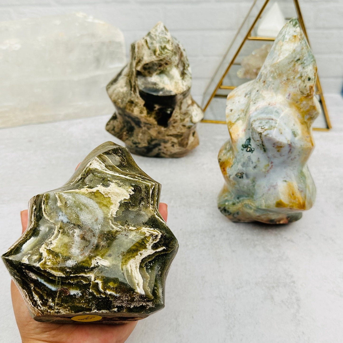 ocean jasper point in hand for size reference 