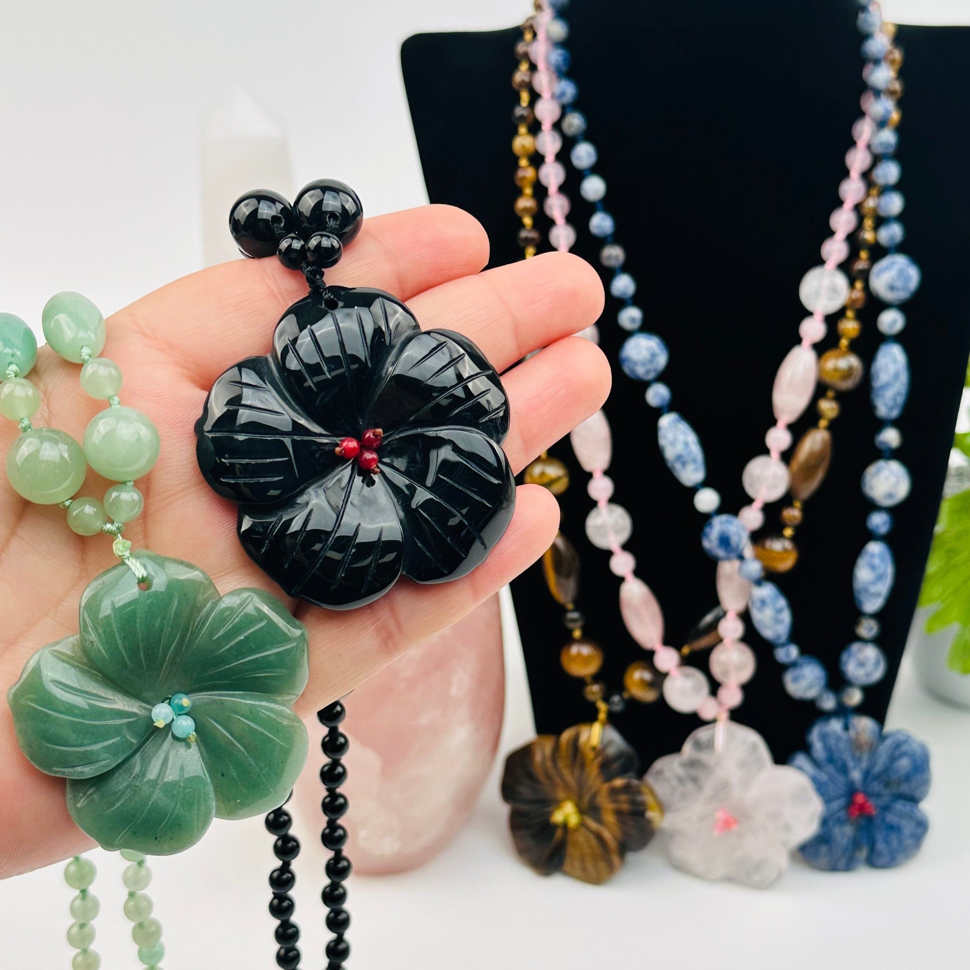 close up of the details on this gemstone glower necklace 