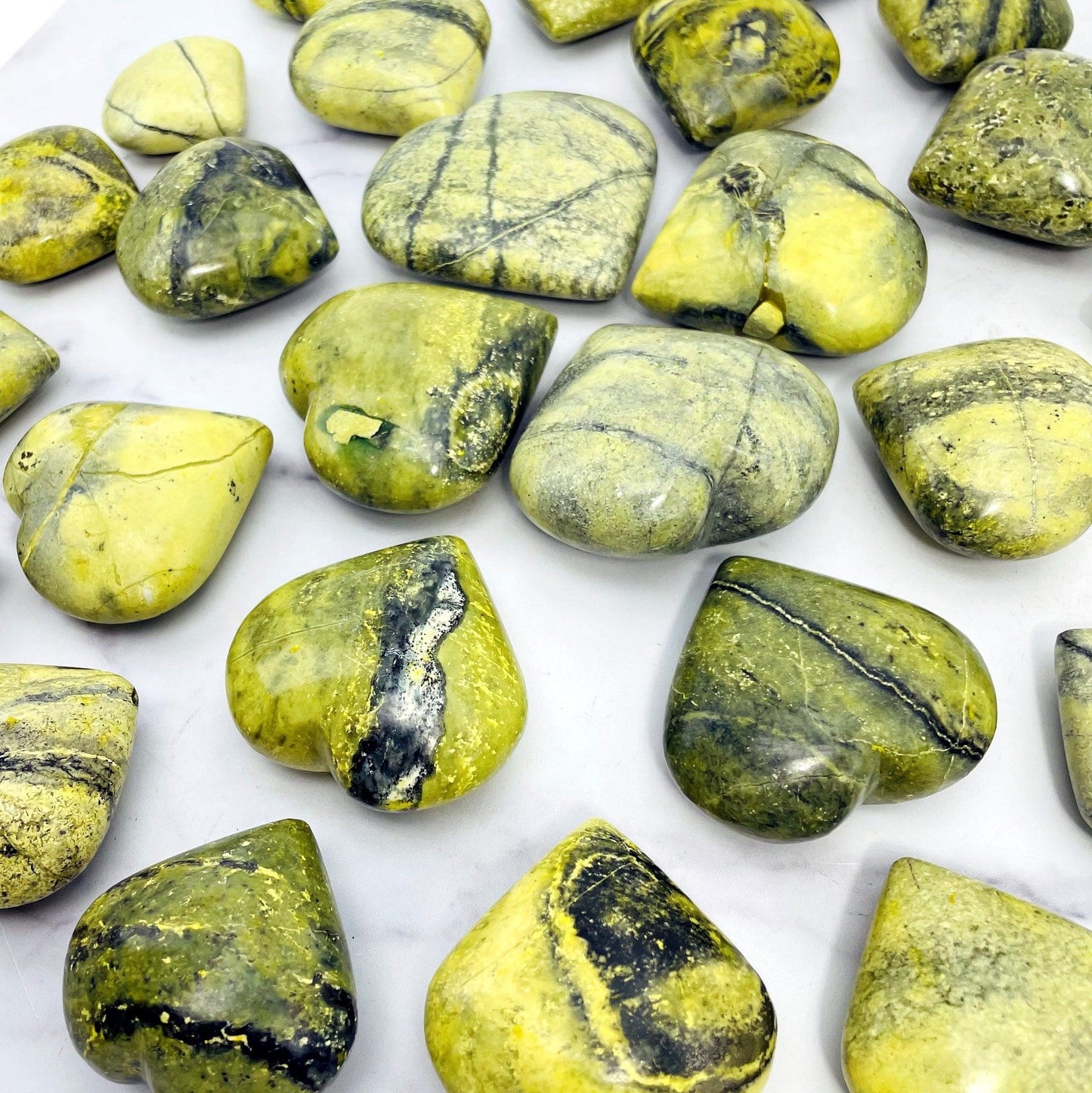 many serpentine polished hearts on display for possible variations 