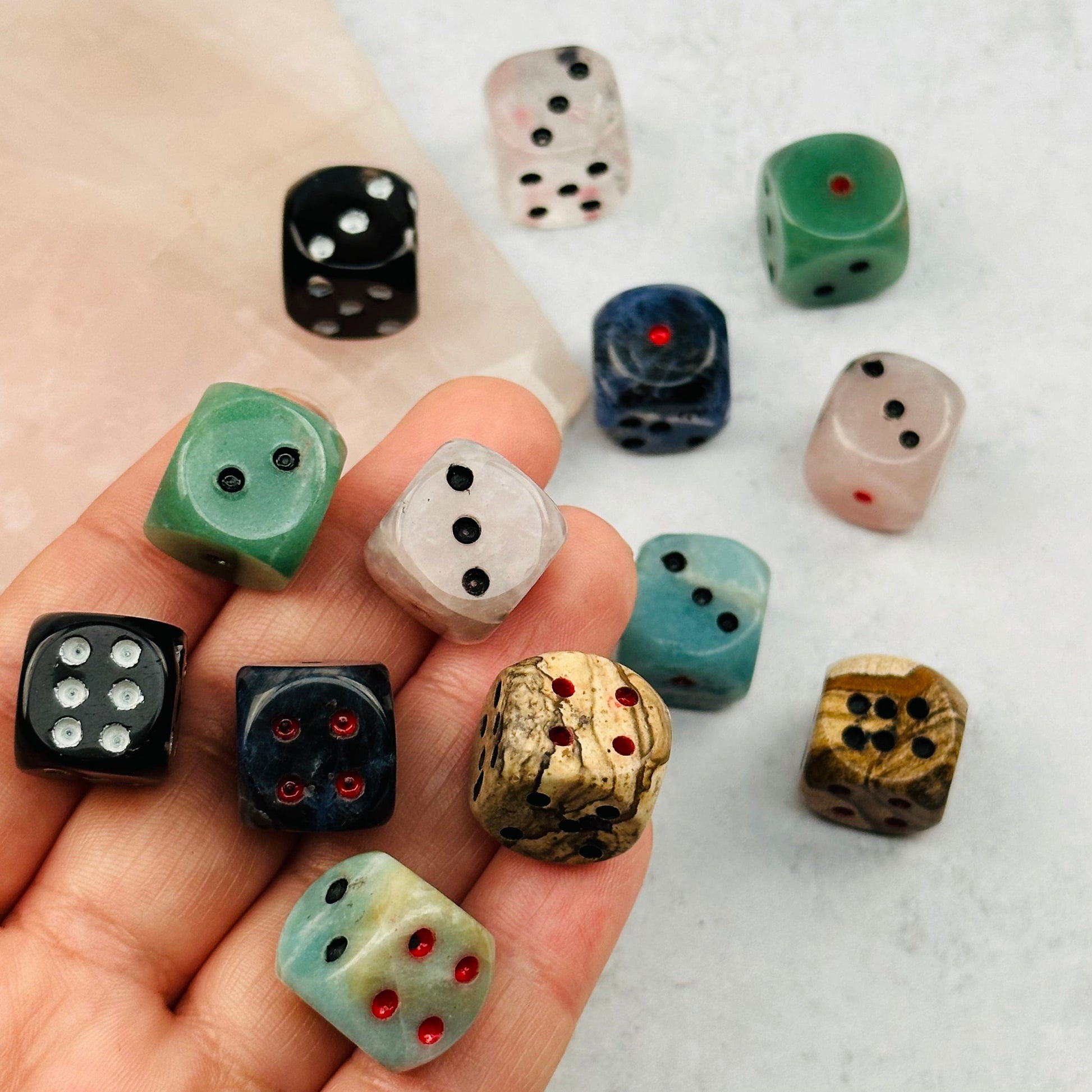Gemstone Dice in hand for size reference 