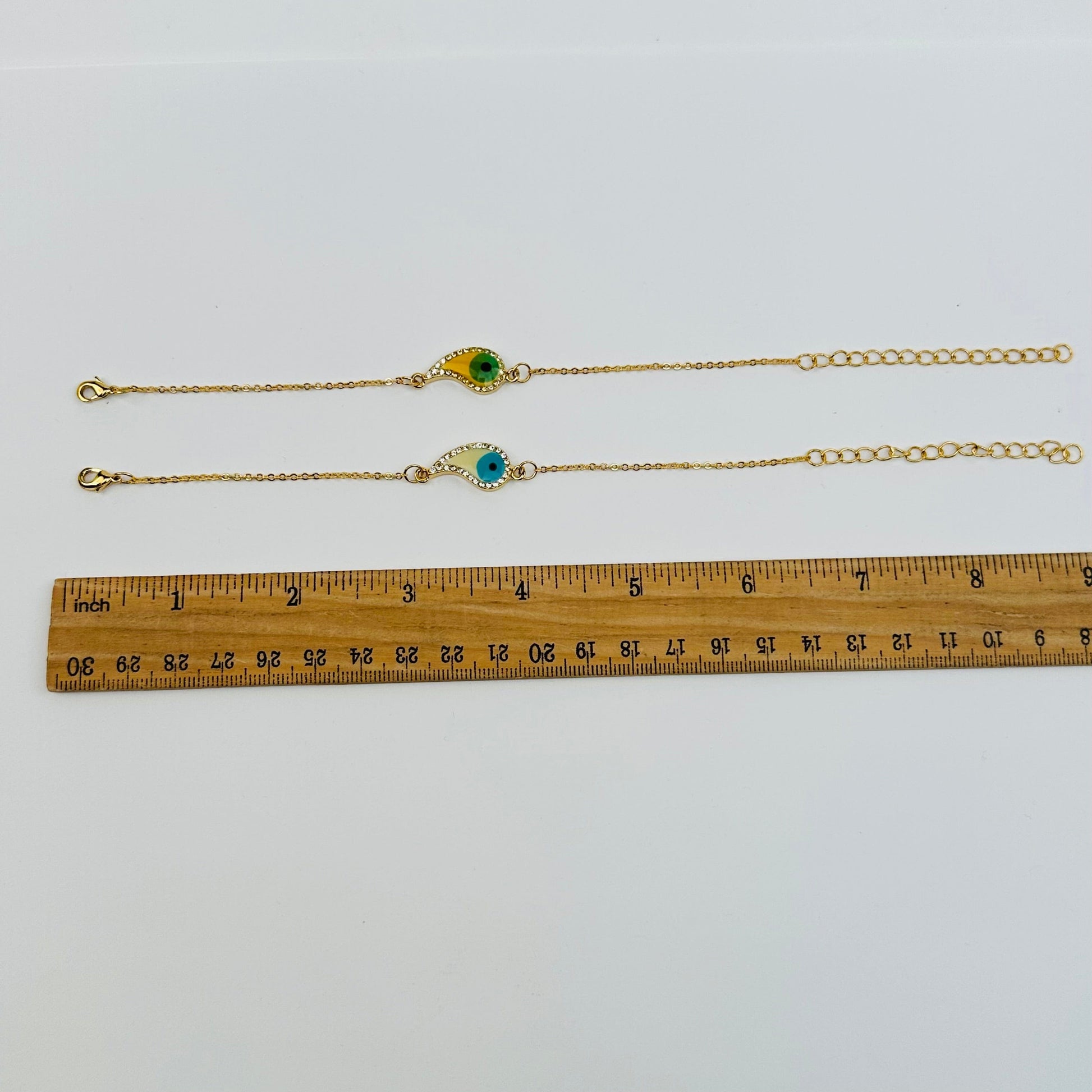 bracelets displayed next to a ruler for size reference 