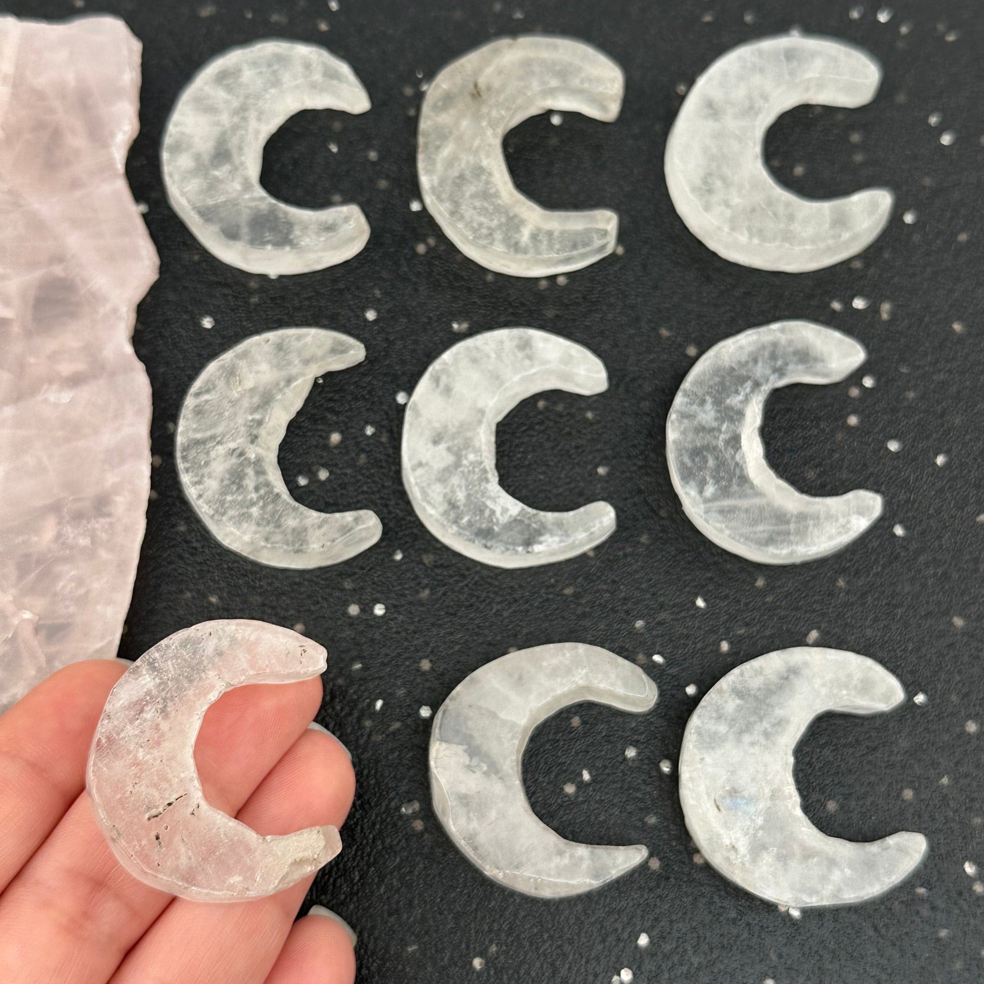 crystal quartz moon crescent in hand for size reference 