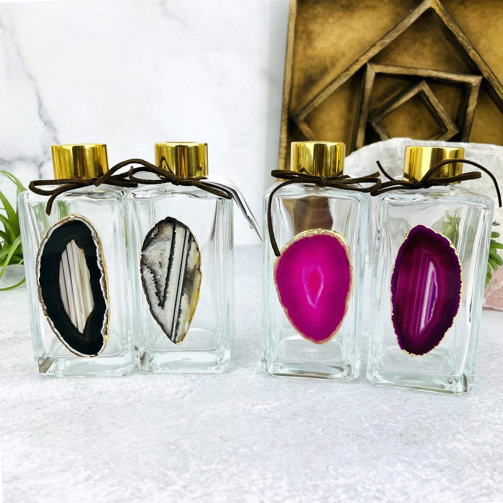 Picture of two of our black and two of our pink diffusers being displayed next to each other.