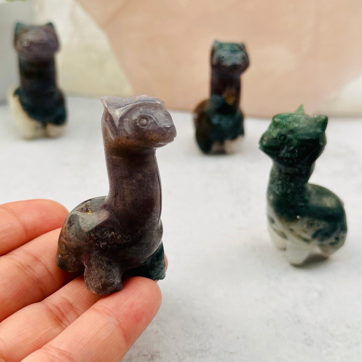 carved alpaca in hand for size reference 