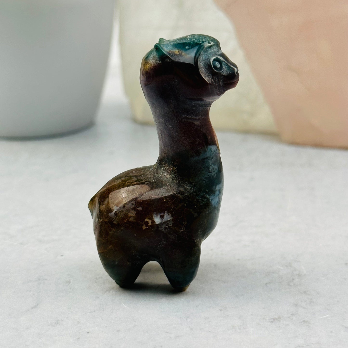 Carved Gemstone Alpaca displayed as home decor 