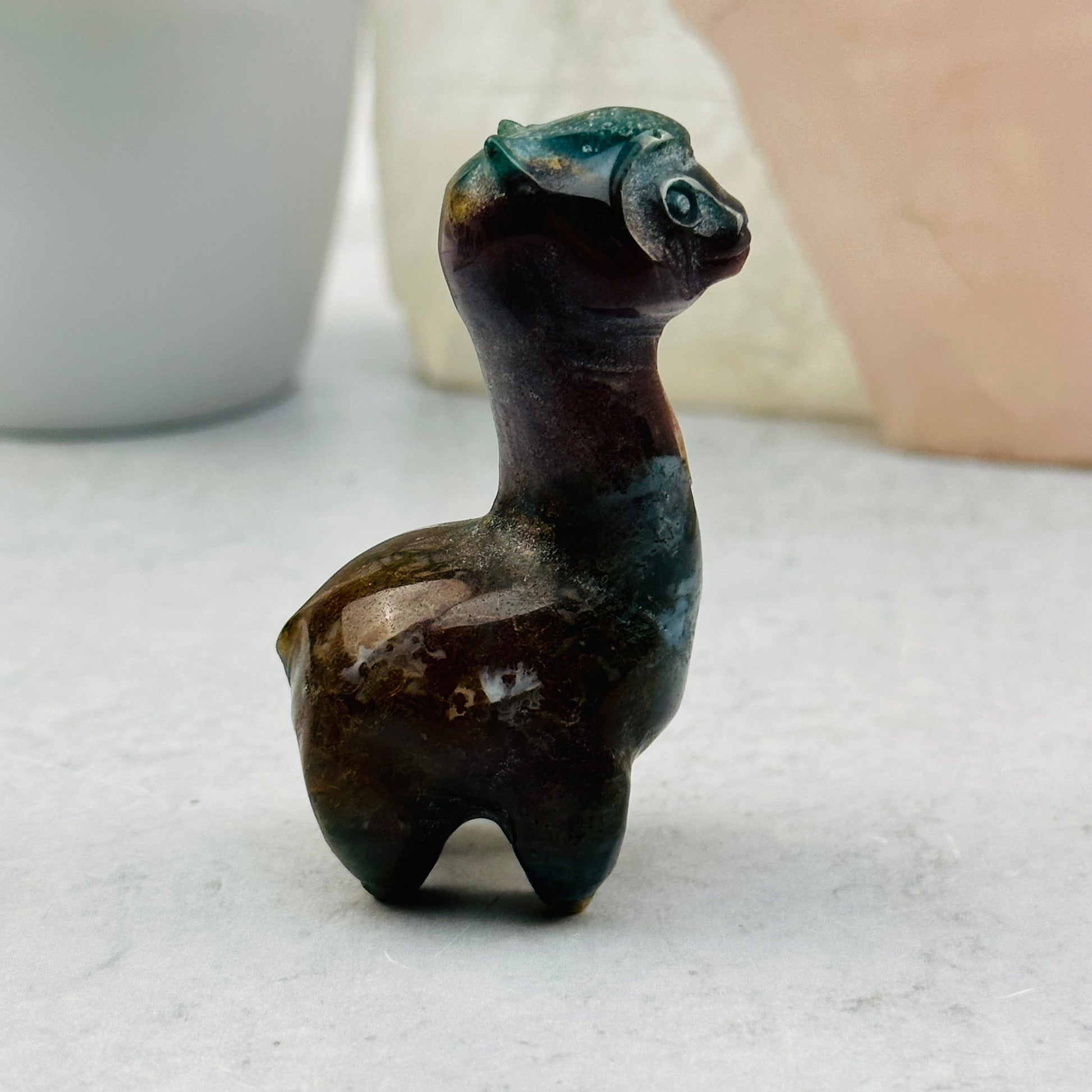 Carved Gemstone Alpaca displayed as home decor 