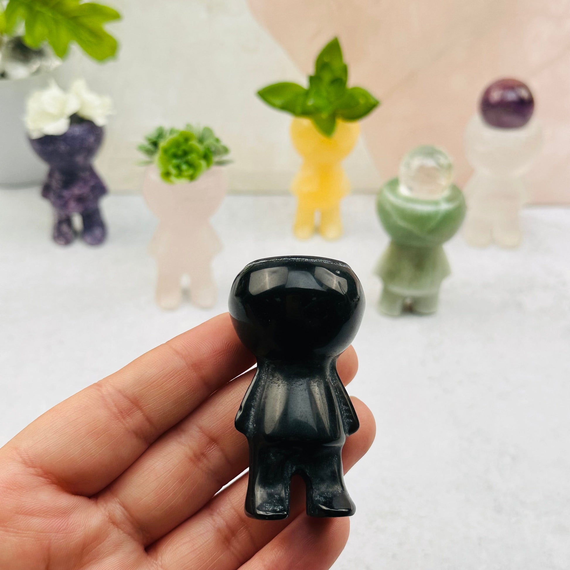 carved stone in hand for size reference 