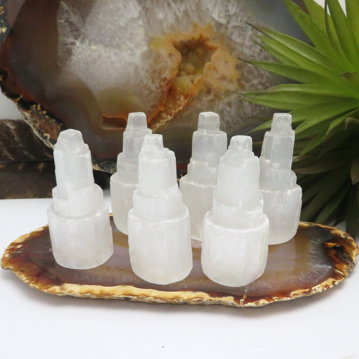 many selenite raw crystal towers on display for possible variations