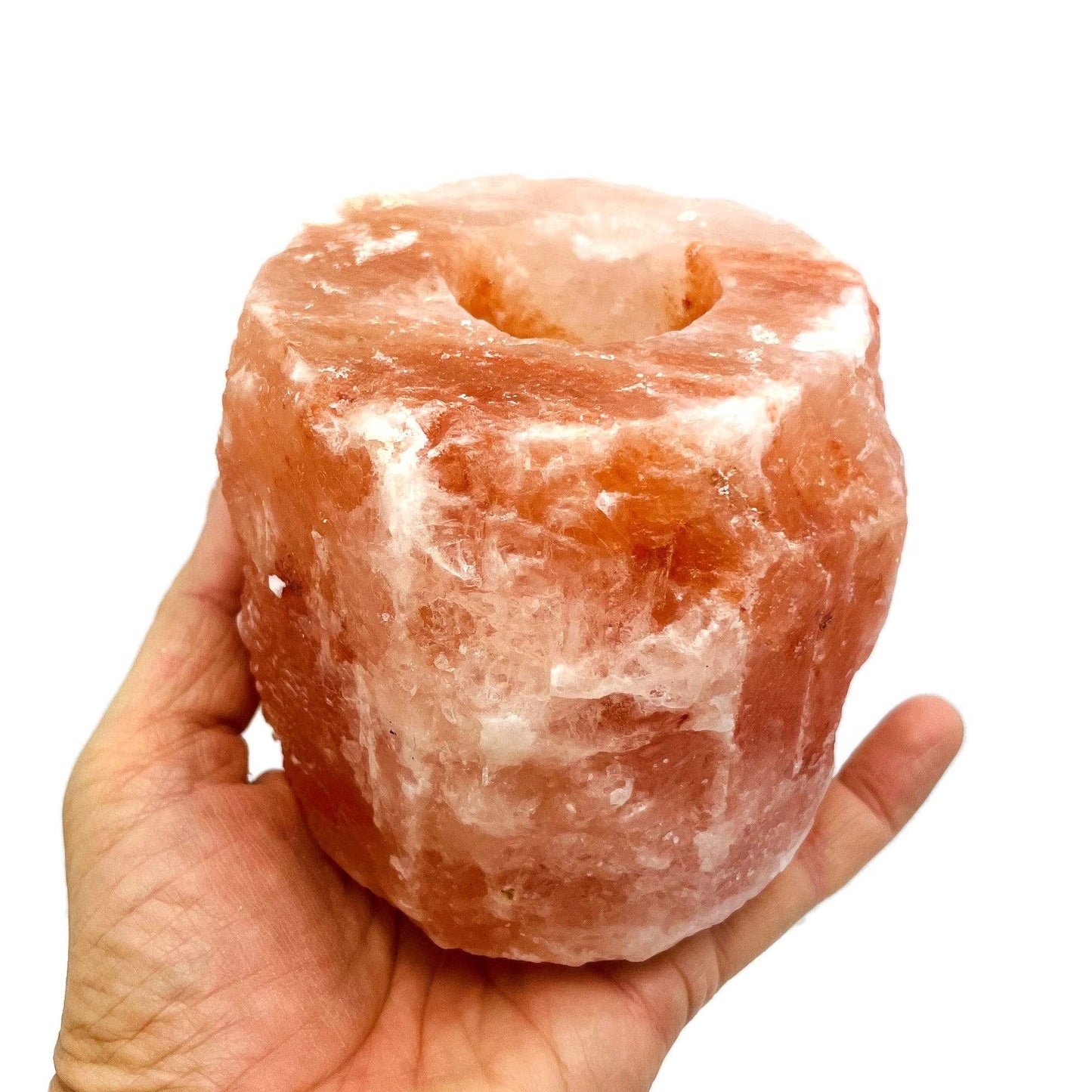 1 hole Himalayan Salt Candle Holder in a hand for size reference