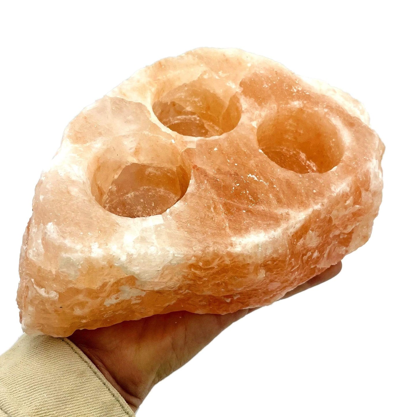 3 hole Himalayan Salt Candle Holder in a hand for size