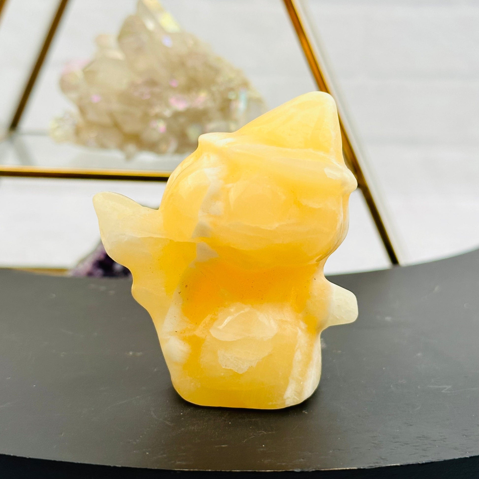 Carved Gemstone Pumpkin Head Witch displayed as home decor